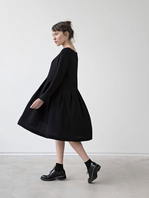 
                  
                    Black Silk Dress with Pleats and Buttons at the Back
                  
                